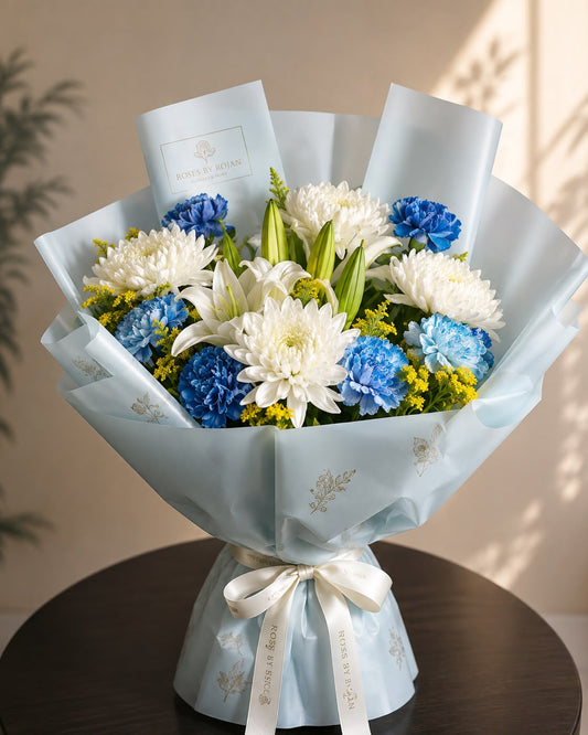 Sky Whisper Bloom: blue and white solidago, carnation, chrysanthemum in a bouquet
